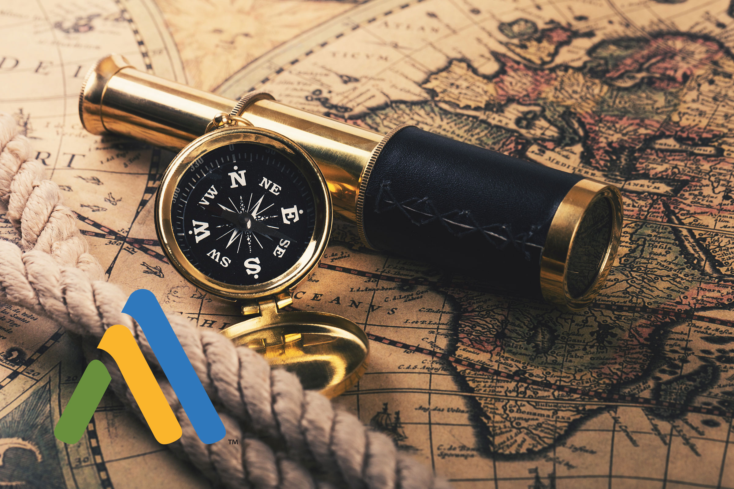 Compass and telescope on vintage map background.