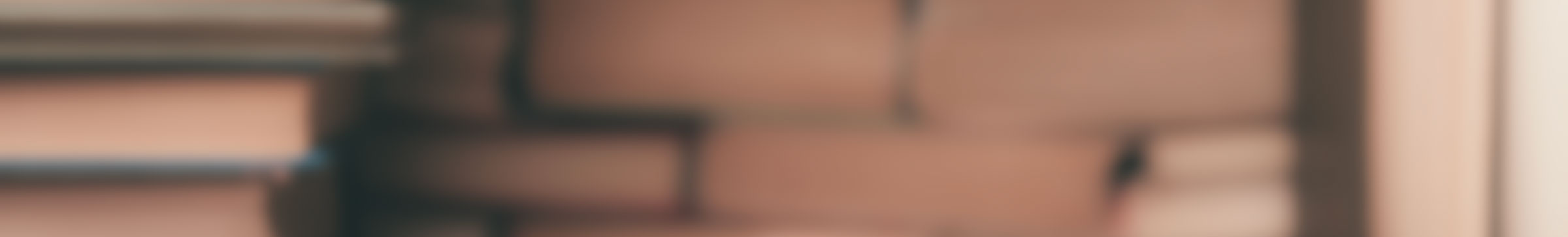 Blurred stack of books on shelves