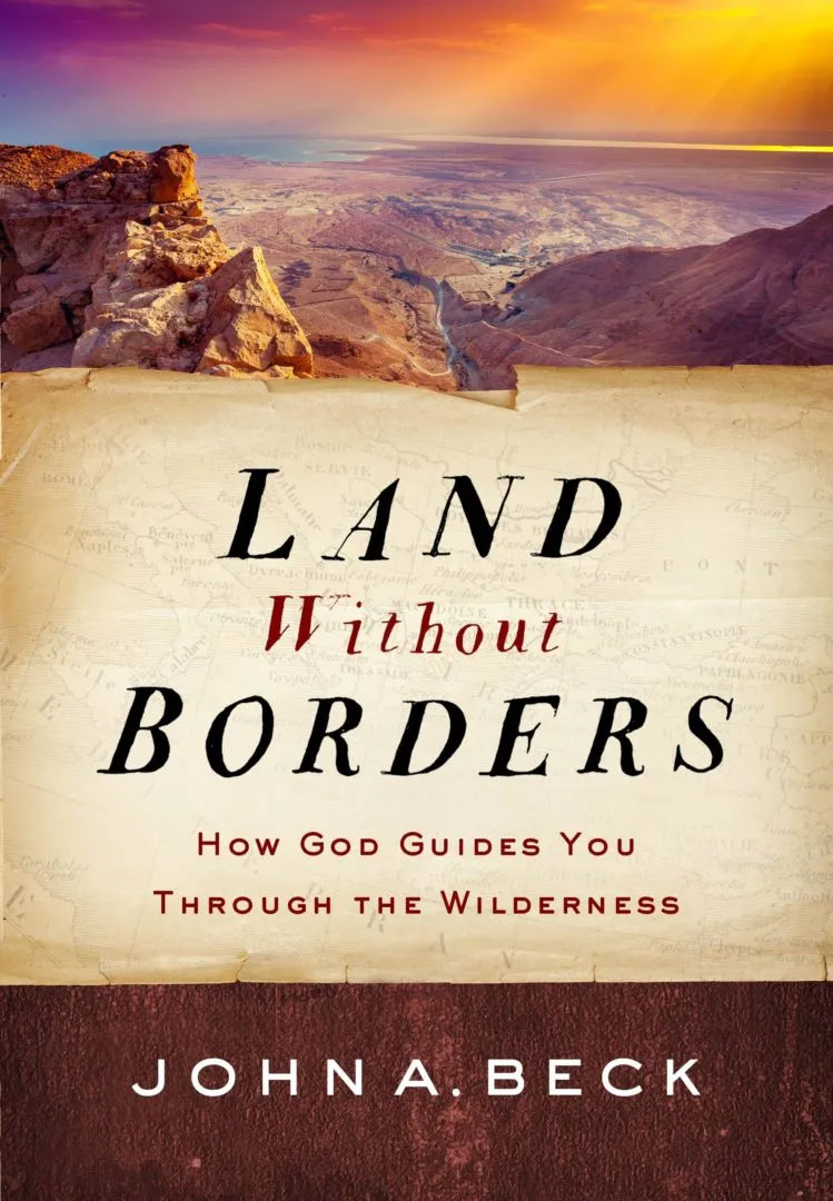 Land without Borders cover with desert landscape.